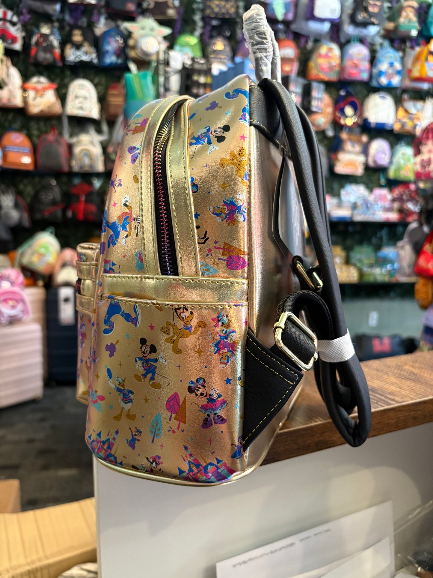 Loungefly Disney Parks 70th Anniversary Mini Backpack AOP