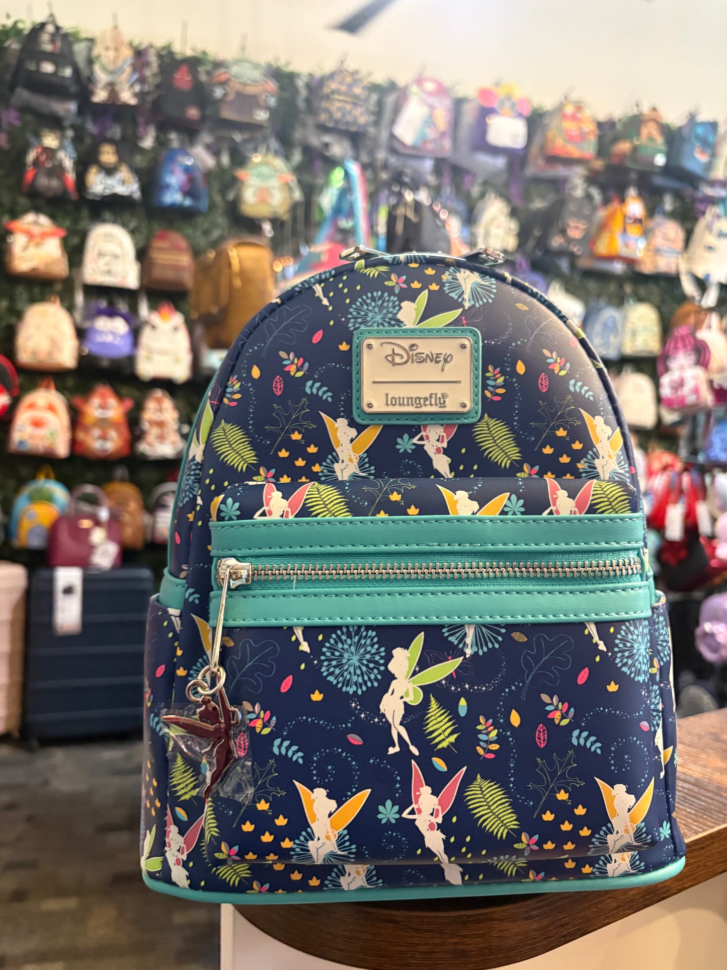 Loungefly Disney Teal Tinkerbell AOP glows in the dark mini backpack
