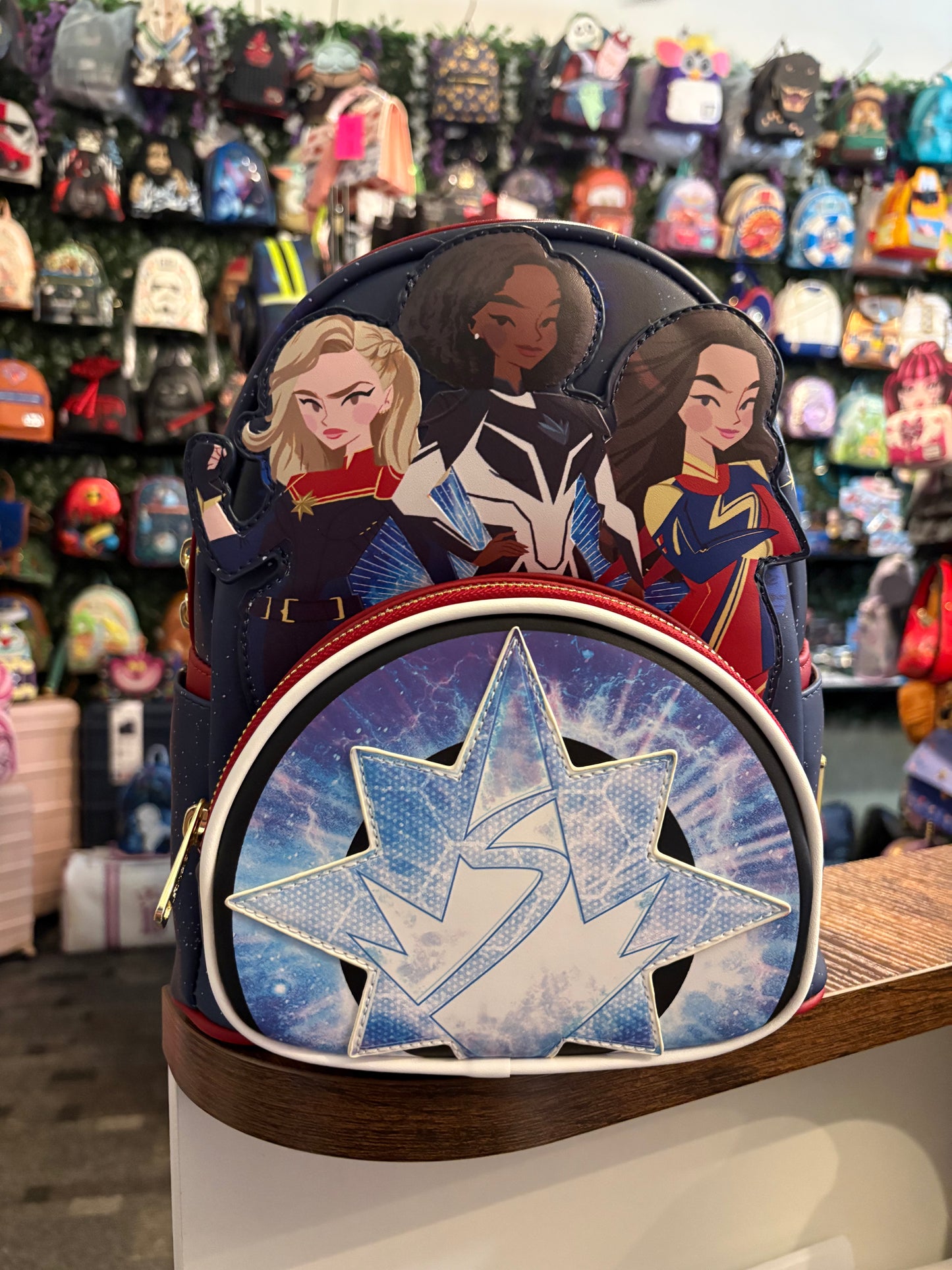 Loungefly Marvel The Marvels Group features Captain Marvel, Photon, and Mrs Marvel Mini Backpack