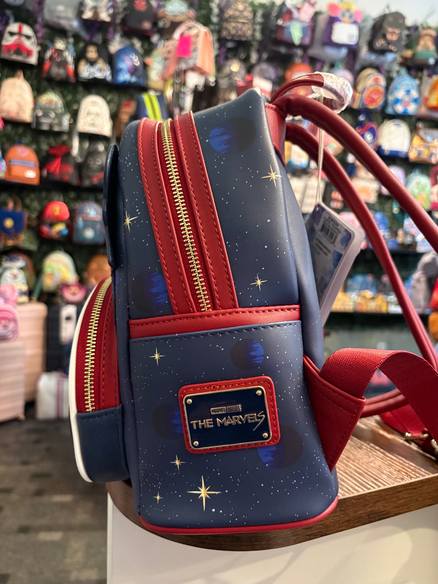 Loungefly Marvel The Marvels Group features Captain Marvel, Photon, and Mrs Marvel Mini Backpack