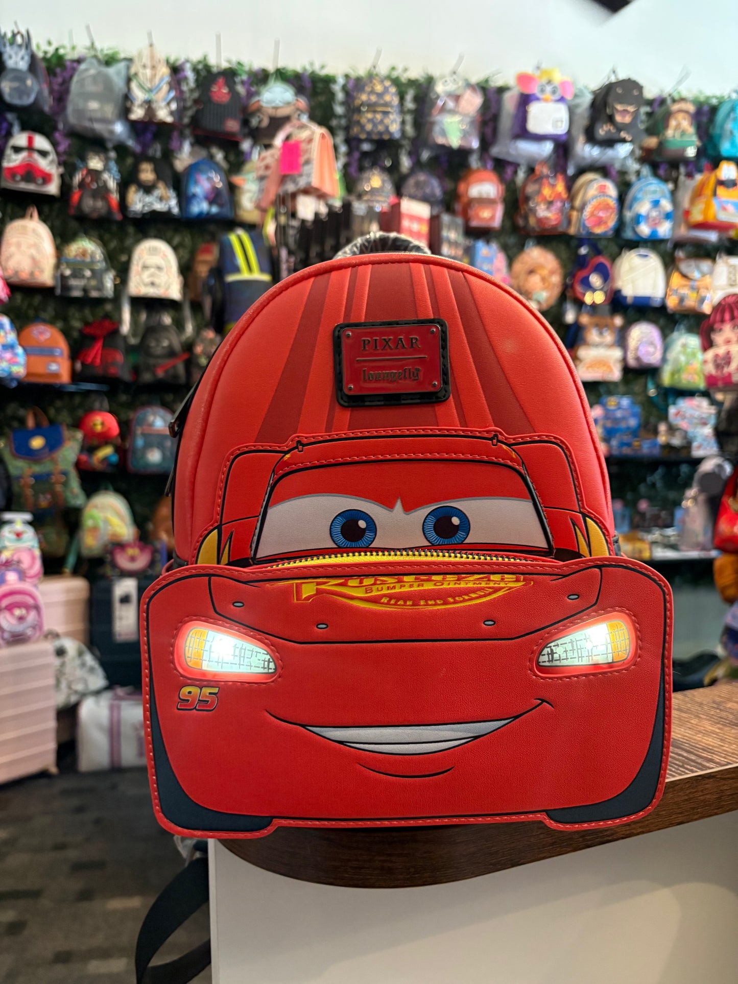 Loungefly Disney Lightning McQueen mini backpack headlights light up