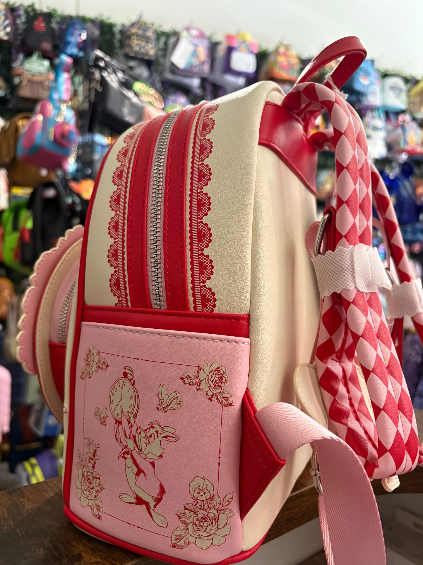 Loungefly Pink and Red Alice Sketch scene mini backpack